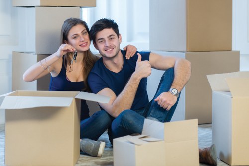 Professional flat removals team preparing boxes in Gospeloak