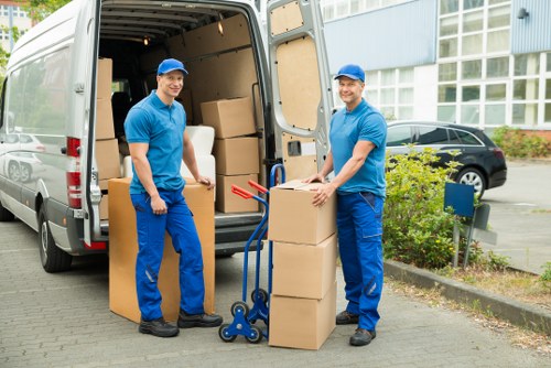 Organised household boxes and furniture ready for relocation in Gospeloak